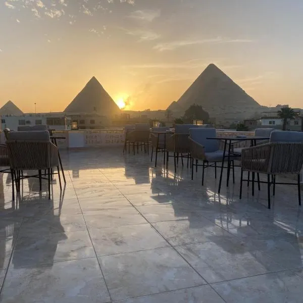 Queen Ash Pyramids View INN, hôtel à Madīnat Sittah Uktūbar