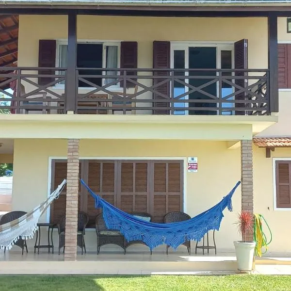 Férias e alegrias em casa pé na areia!, hotel in Penha