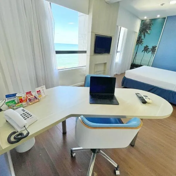 Mercure 1404 · Suíte moderna com vista p/ o mar