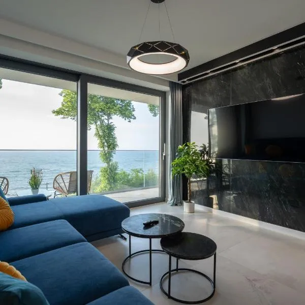 Apartament z widokiem na morze Hevenia, hotel in Rewal