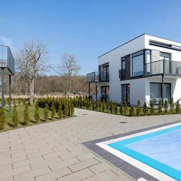Paraiso Nadmorskie Apartamenty z Basenem i Parkingiem by Noclegi Renters, hotel in Łukęcin