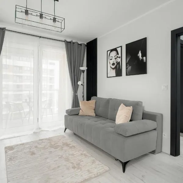Wyjątkowy i Nowoczesny Apartament z Balkonem i Parkingiem by Noclegi Renters, hotel in Poznań