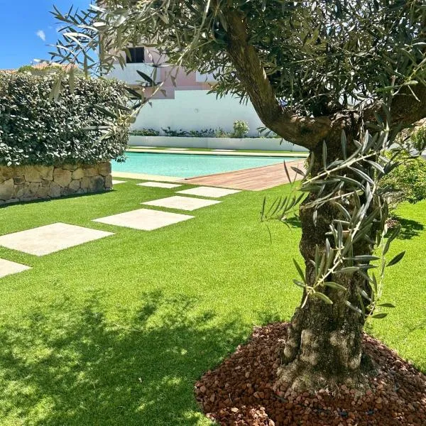 splendido appartamento con piscina a due passi dalla spiaggia, hotel in Palau