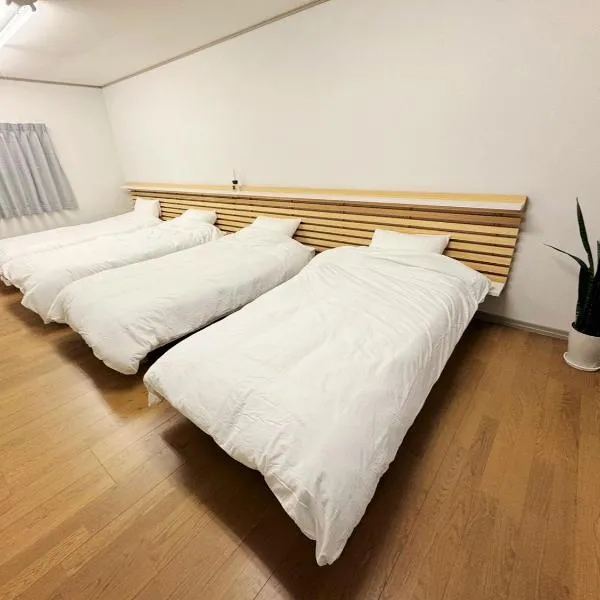 ゲストハウスサンパティオ, hotel v destinaci Šingu