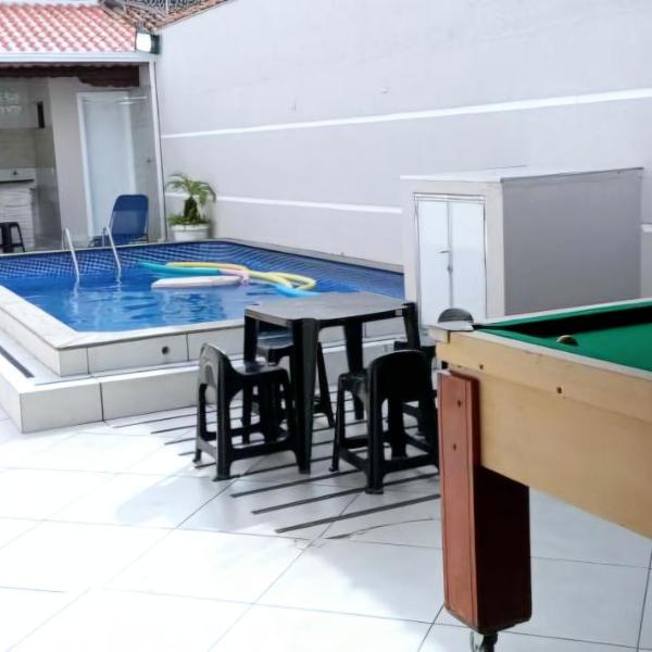 "Lindíssima Casa Pé na Areia com Opção da Piscina Aquecida Cobrado a Parte, Sala de Jantar, 3 Amplos Quartos, Sendo1Suíte, Amplo Espaço de Lazer com Área Gourmet em Deck Coberto com Churrasqueira e Mesa de Bilhar Frente a Piscina, Super Pertinho da Praia" - Foto 3