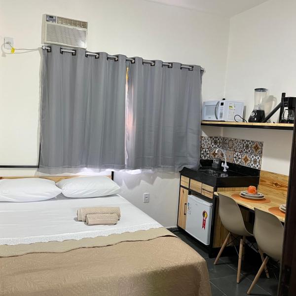 Flat com ar e varanda com linda vista para o Ibituruna - Vôo Livre 203