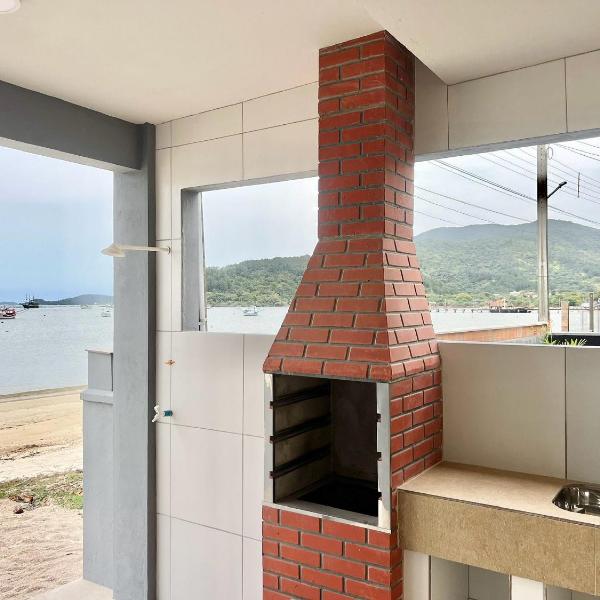 Pé na areia! Aconchegante casa frente Mar! CO02I
