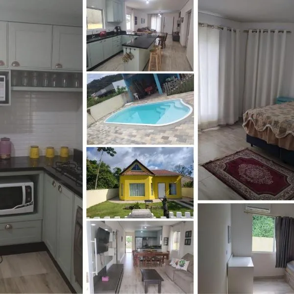 casa 700m da praia, ideal para família, 3 quartos , piscina, ar condicionado, churrasqueira, wi fi, estacionamento, até 10 pessoas, โรงแรมในอิตาโปอา