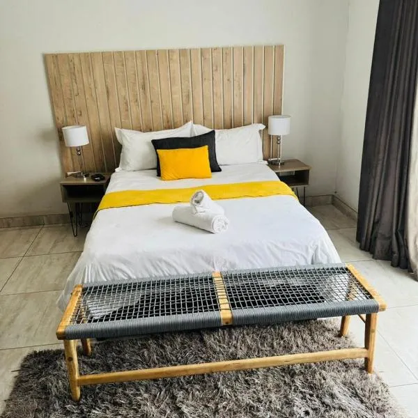 Kioma Guest House، فندق في موكوبانى