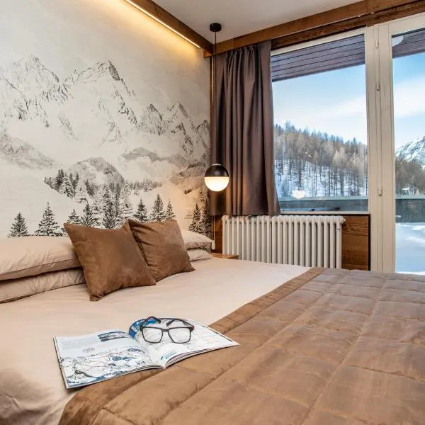 WHISPERING PINES LODGE Mountain view apartment with ski-in access, отель в городе Брёй-Червиния