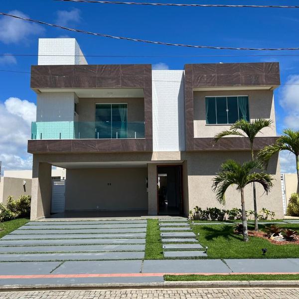 Mansão de luxo em condômino pé na areia