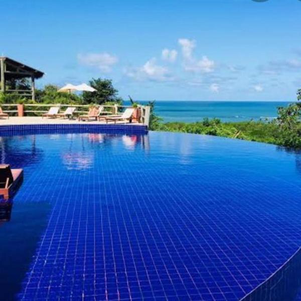 Quarto e sala com piscina em Maceió - Villas Tulipa 02