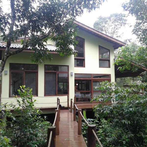 Beach house surrounded by lush nature