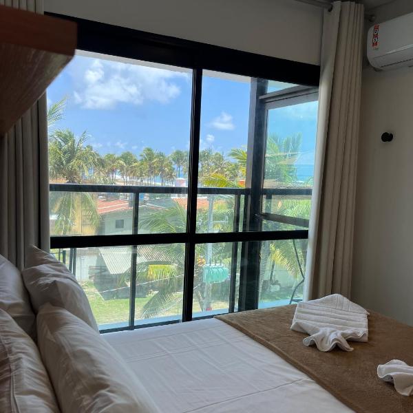 Vista privilegiada de coqueiral e mar, Rooftop, Piscina e Pé na Areia em Maraca