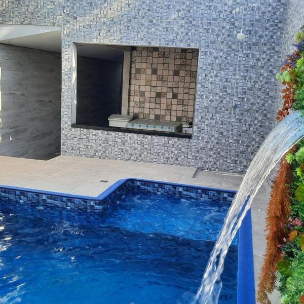 Casa aconchegante com piscina a 50 metros da praia