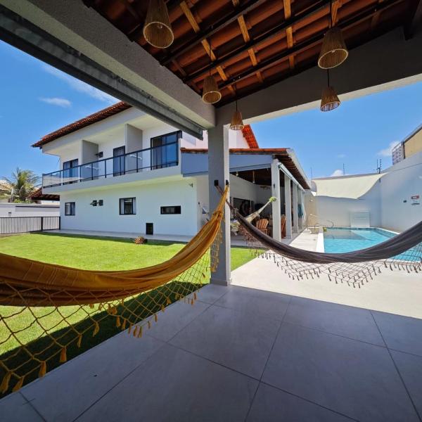 Quase beira mar, casa muito nova com 5 suítes, vista mar, piscina grande, cozinha completa, 4 vagas e perto de mercado, restaurantes e bares - CLIQUE E VEJA AS FOTOS - Foto 4