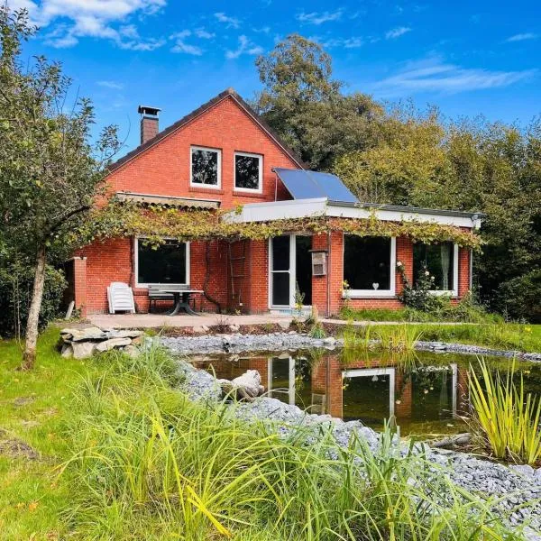 Ferienhaus Warf mit Wintergarten Kamin und Teich，奧利希的飯店
