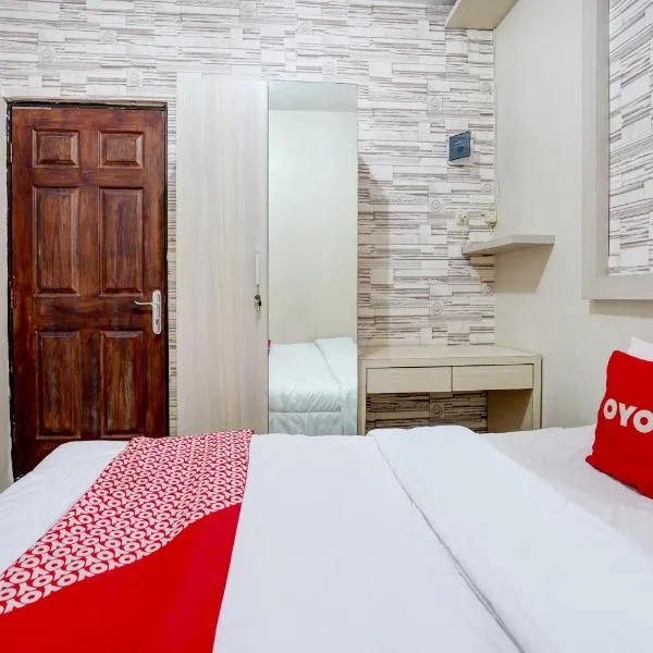 OYO Life 90606 Glass House Citraland Syariah, hotel in Surabaya
