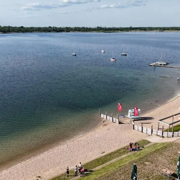 Ferienhaus am Schladitzer See Leipzig Messe Flughafen, отель в городе Шкойдиц