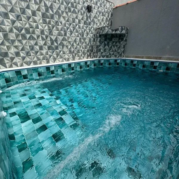 Casa em Itanhaém com Piscina Alto Padrão Próximo da Praia, hotel in Itanhaém