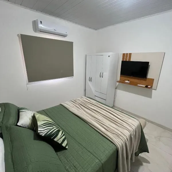 AP 5 C/Garagem>Ar>Wifi>Cozinha>Tv Disney+>Pet free, hotel in Ji-Paraná