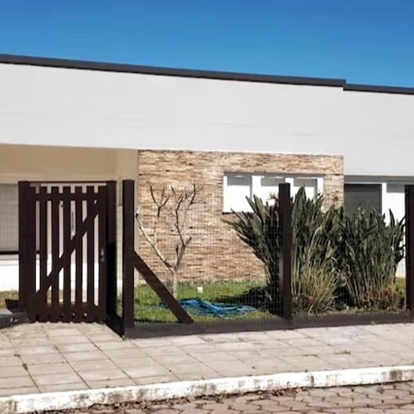 Casa com 4 dormitórios e piscina em Xangri-lá