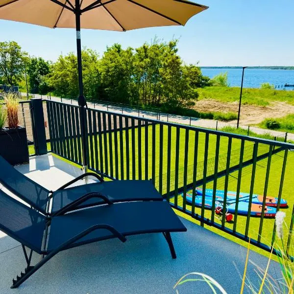 8 Personen Ferienhaus ,,Seegelblick" am Goitzschesee, erste Reihe am Strand mit Sauna, Kamin, Wallbox & SUP, hotel v destinaci Pouch