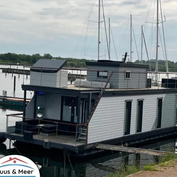 Hausboot Sundowner - Huus & Meer, hotel em Großenbrode-Kai