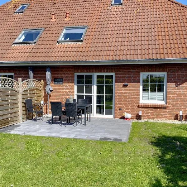 Nessmersiel, Renovierte Erdgeschosswohnung mit Garten in Deichnähe, Wallbox, Bettwäsche inklusive, hotel in Neßmersiel