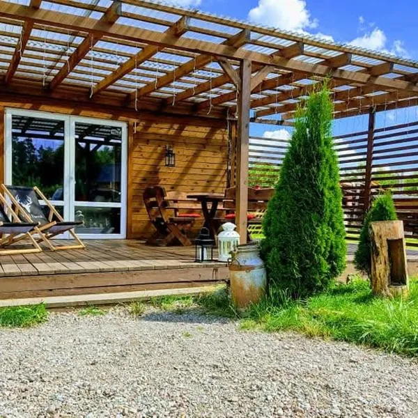 Domek uroczy i wilcza chatka,klimat górski na Kaszubach,balia,sauna,ognisko, hotel in Sikorzyno