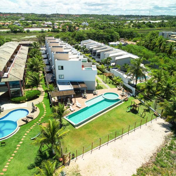 Casa Turquesa Pé na areia Piscina infinita Pet friendly Condomínio fechado