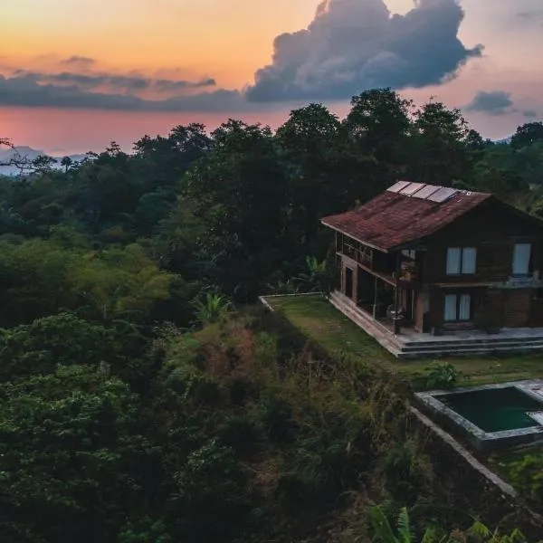Master bed room in Bukit Cottage, hotel in Noca