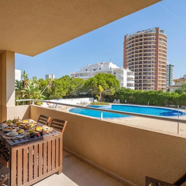 Spacious & Sunny Apartment with Pool by HostWise, hotel in Portimão
