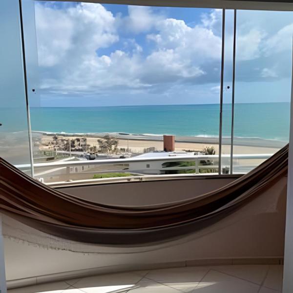 Flat pé na areia à beira-mar