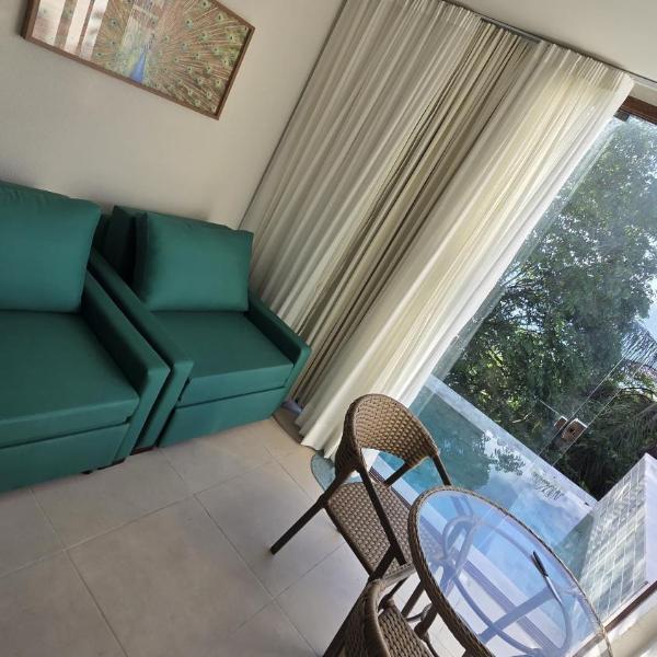 Apartamento com piscina e vista pôr do sol