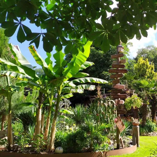 Ferienwohnung Exoten-Paradies im Garten Seggewiß - Tierfreie Nichtraucherwohnung in Raesfeld, Kreis Borken、Raesfeldのホテル