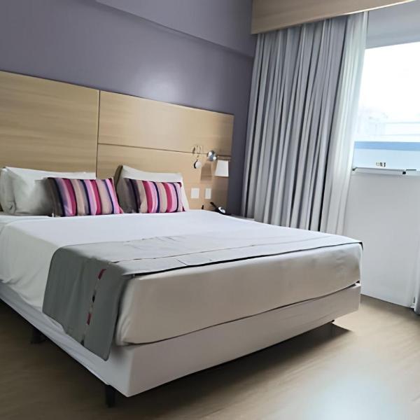 Suíte em flat no Gonzaga Stay Helbor