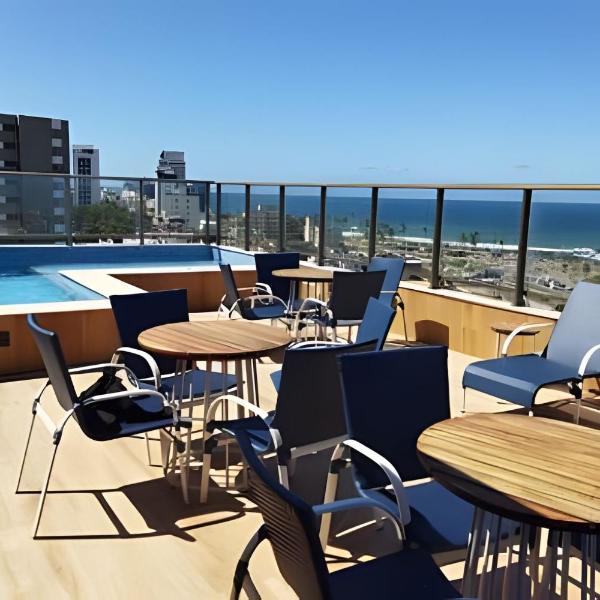 Quarto e sala com vista para o mar