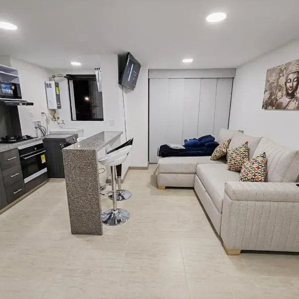 Apartamento moderno frente a la Universidad Santo Tomás WiFi y parqueadero，位于通哈的酒店
