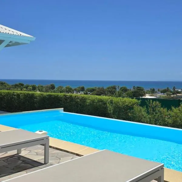 Les villas "Fenêtres Sur Plage" - Villas Créoles de charme , vue exceptionnelle face mer et plage & piscines privées à débordement, hotel en Saint-François