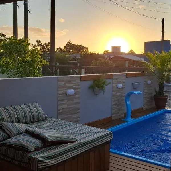 Casa aconchegante com piscina em Nova Tramandai, khách sạn ở Tramandaí
