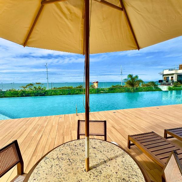 Apto em condomínio Pé na areia 3 Quartos Cozinha Completa Sacada com Churrasqueira Vaga de Garagem Piscina borda infinita Academia Quadra de esportes Sala de Jogos Summer Home Club acesso direto a praia - Foto 3
