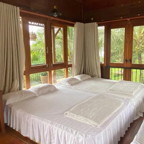 Lá Homestay Đăkmil, hotel en Ðak Lao