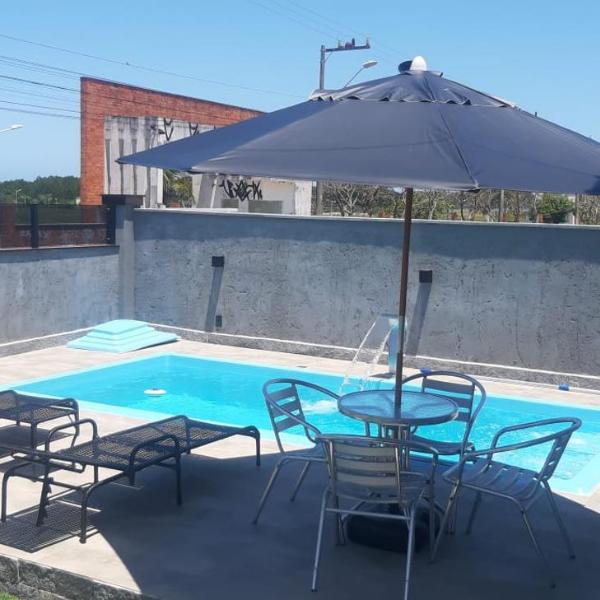 Casa com piscina na praia
