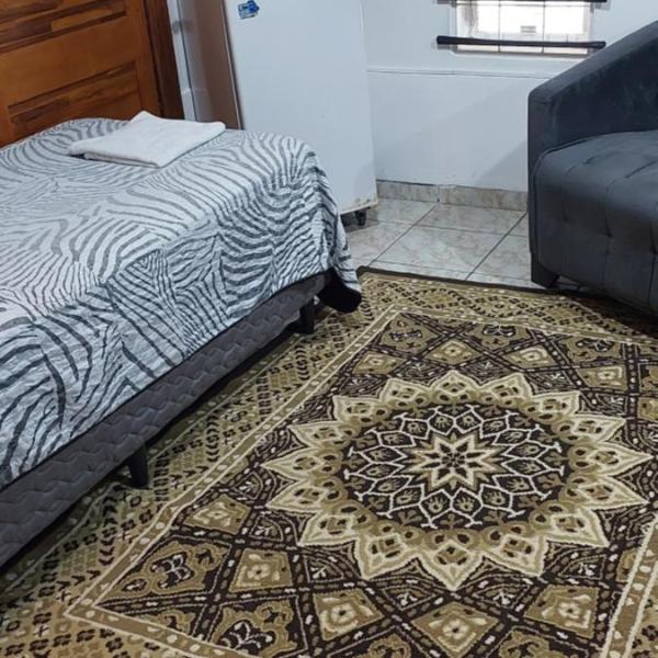 Quarto individual em casa compartilhada com ar condicionado