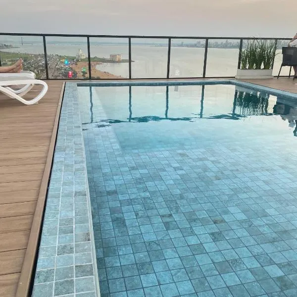 Bello apartamento en edificio Vivo Costanera Frente a la playa! Con Parking, viešbutis mieste Enkarnasjonas