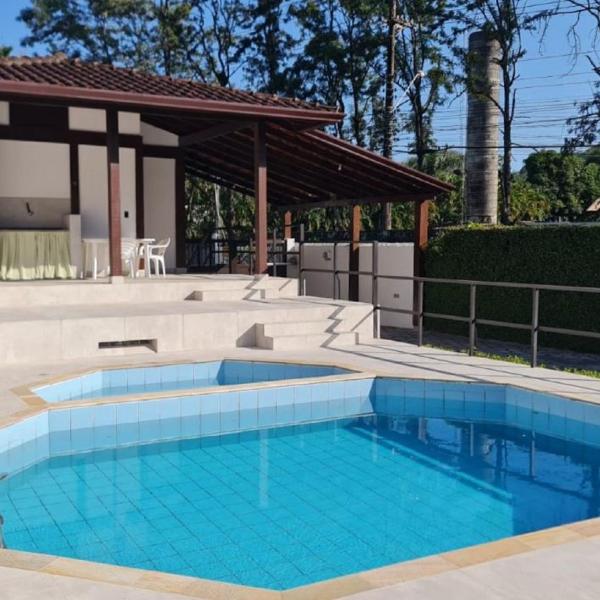 Two-story house in a gated community with a swimming pool