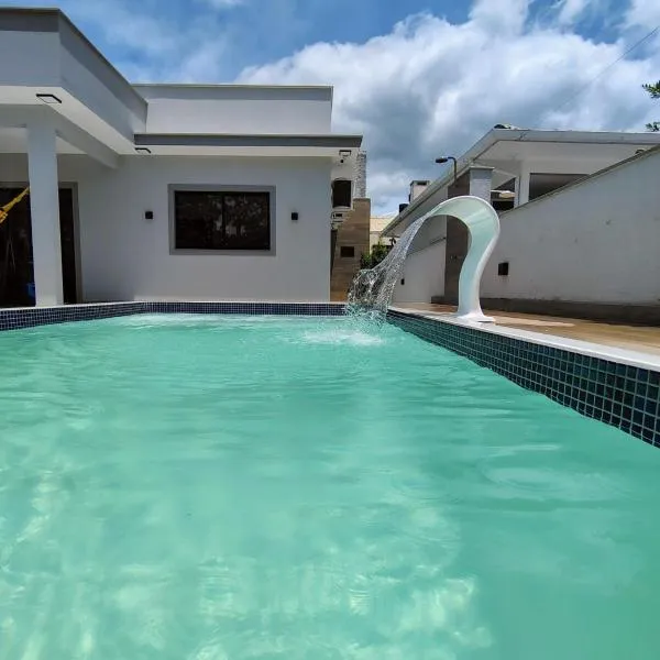 Casa com piscina praia da Pinheira - Brisa das Amendoeiras, viešbutis mieste Paljosa