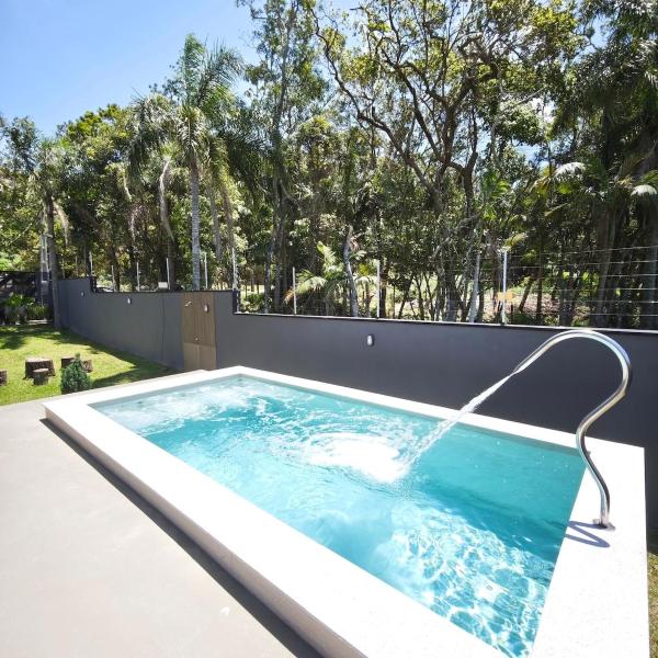 Casa Woods seu Refúgio na Praia do Estaleiro