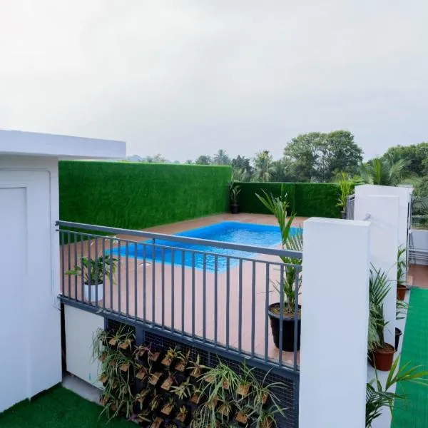 Munderi Green Mounts - Family Rooms with Swimming Pool، فندق في كالباتّا